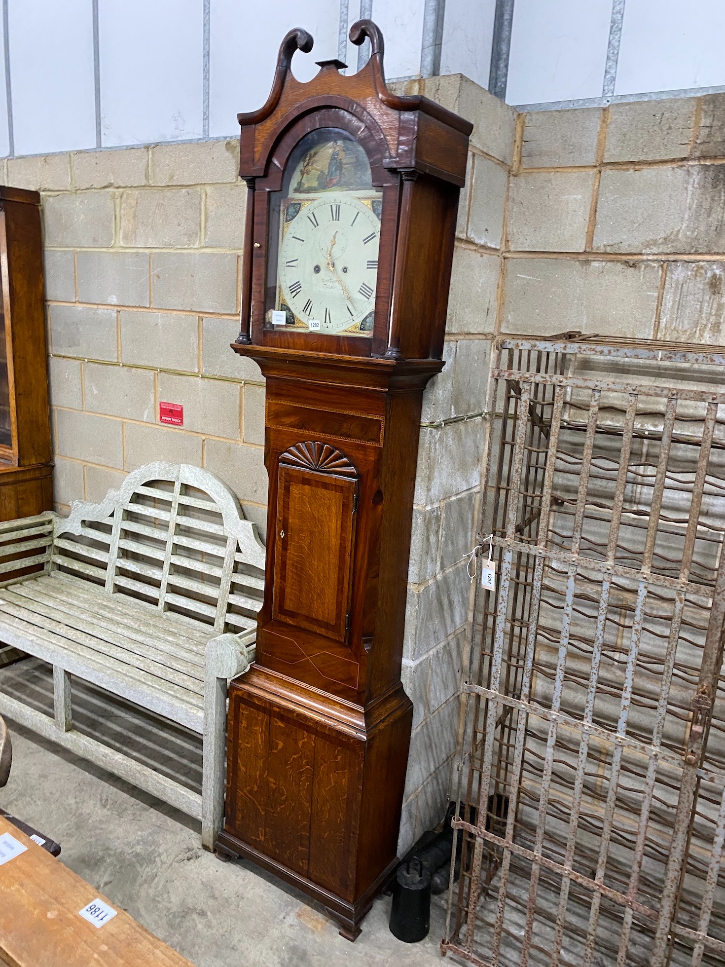 An early 19th century mahogany banded oak 8 day longcase clock with painted dial, height 229cm
